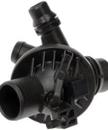 Heavy Duty Engine Coolant Thermostat Housing Assembly No Sweat Direct Swap For Your Road Rig showing black plastic housing with various outlet ports.
