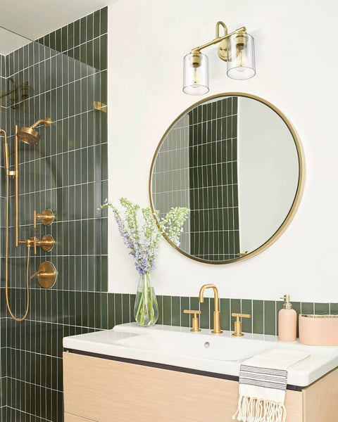 Bathroom with Brushed Nickel 3-Light Vanity Light With Clear Glass Shade above round mirror, modern wall fixture for hallways