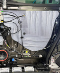 200 Mil Thick Soundproofing Mat Roll for Cars Trucks and Vans 36 Square Foot installed inside a vehicle door.