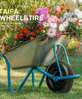 13 Inch Solid Flat Free Replacement Tire And Wheel 4.00-6 With Five Eighth Inch Axle Bore installed on a blue wheelbarrow in a garden.