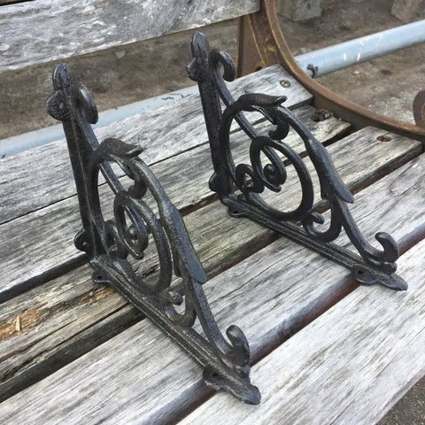 Rock Solid Cast Iron Shelf Brackets Heavy Duty Wall Mount Braces with vintage design, 6.8 x 5.7 inches, black finish.
