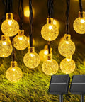 Outdoor Waterproof Solar String Lights 2 Pack, 72 Ft Total, 120 LEDs, 8 Lighting Modes, Solar Powered Patio Garden Lights displayed on grass