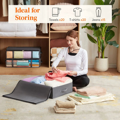 Person organizing clothes in Under Bed Storage Bags 40L Set Of 3 With Front Clear Window Foldable Closet Organizers in gray.