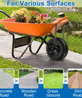 Orange wheelbarrow with flat-free wheelbarrow tires and wheels 14.5 inch universal fit solid tires on garden path
