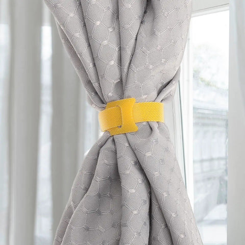 Ditch The Cord Chaos And Snag These Ridiculous 100 Piece Reusable Nylon Cable Ties Color Coded Wire Organizers For Zero Stress Tech Setup And Clean Workspace Storage. Yellow nylon tie securing gray curtain.