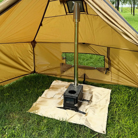 40 Inch Fire Pit Mat For Deck And Grill, Fiberglass Insulated Under Stove Pad With 940F Safety shown under a tent stove outdoors