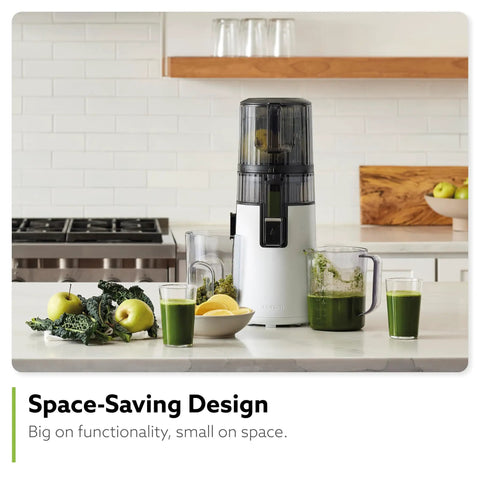 Hurom H70 Cold Press Juicer Easy To Clean Masticating Slow Juicer with green juices and ingredients on a kitchen counter.
