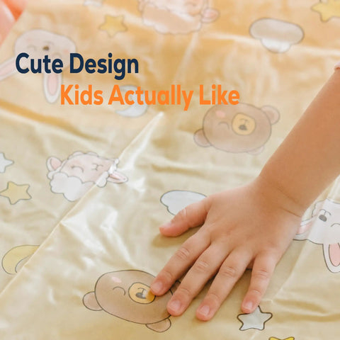 Child's hand on cute design pattern of On-The-Go Toddler Bed Rails Two-Pack Inflatable Bumpers For Travel And Sleepovers