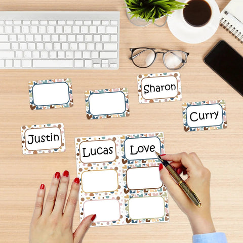Person writing on 180 Pieces Boho Name Tag Stickers For Classroom Use Dope Heart And Polka Dot Labels For Teachers