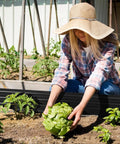Gardener planting in Durable Galvanized Steel Raised Garden Bed For Outdoor Gardens 8x4 Feet Open Bottom Planter Box