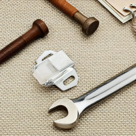 Rock Solid Roller Latch Set for cabinet doors and mailbox doors, iron with silver finish, shown with installation tools