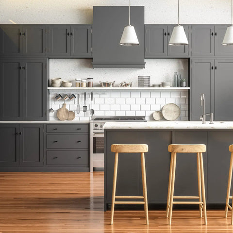 Modern kitchen with Flat Black Rectangle Cabinet Knobs Set, 25 Pack Kitchen Drawer Handles on gray cabinets, wooden bar stools at counter.