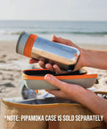 Person holding All In One Portable Coffee Maker With Vacuum Pressure Brew Hand Powered On The Go Coffee Brewer Insulated Stainless Steel Travel Mug 10 Ounce Thermo Cup Quick Fresh Brew For Commutes And Outdoors at the beach with a carrying case.