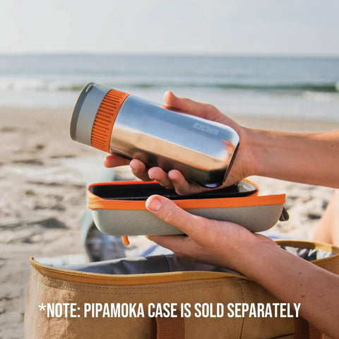Person holding All In One Portable Coffee Maker With Vacuum Pressure Brew Hand Powered On The Go Coffee Brewer Insulated Stainless Steel Travel Mug 10 Ounce Thermo Cup Quick Fresh Brew For Commutes And Outdoors at the beach with a carrying case.