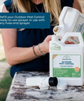 Person pouring Outdoor Pest Control Spray Concentrate With Natural Essential Oils, 16 oz, into a sprayer outdoors.