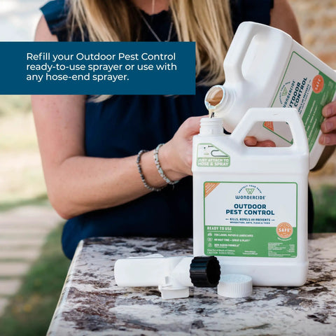 Person pouring Outdoor Pest Control Spray Concentrate With Natural Essential Oils, 16 oz, into a sprayer outdoors.