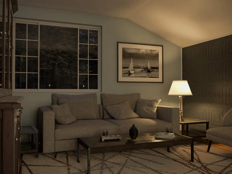 Living room with Spyglass Table Lamp With Antique Brass Finish, linen shade, 30.5 inches tall, beside a sofa and window at night.
