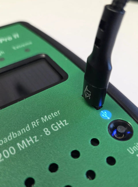 Compact Rechargeable RF Meter With USB C Power, Up To 24 Hours Battery Life, Bar Graph RF Intensity, Max Hold, Adjustable Volume, And 3.5mm Audio Jack For Easy Field Monitoring close-up with antenna