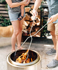 People using Bonfire Accessory Bundle For Fire Pit With Shield Shelter Roasting Sticks And Tools Weatherproof Your Night