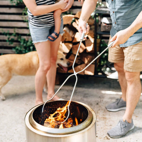 People using Bonfire Accessory Bundle For Fire Pit With Shield Shelter Roasting Sticks And Tools Weatherproof Your Night