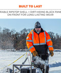 Person wearing Hi Vis Reflective Winter Bomber Jacket With Zip Out Fleece Liner ANSI Compliant Windproof And Water Resistant 300D Ripstop Shell in snowy outdoor setting