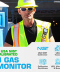 Worker wearing high-visibility vest with NIST Traceable 4 Gas Monitor with O2, CO, H2S and LEL, for industrial safety