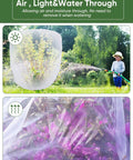 Image of a garden showcasing 4 Pack Garden Netting Pest Barrier With Drawstring Keeps Tomatoes, Blueberries, Vegetables, And Fruits Safe From Birds And Bugs For Greenhouse, Garden, Or Patio Use, Mosquito Netting Cover For Cicadas And Pests, over plants and trees.