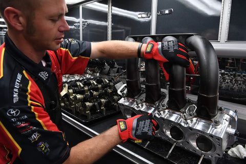 Mechanic using FastFit Work Gloves With Precision Fit For Dexterity And A Grip On Point Anti Slip And Abrasion Resistant Heavy Duty Touchscreen Compatible Vibration Damping Multipurpose Use Size Large Color Red