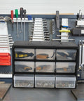 Top Shelf Nine Drawer Plastic Storage Cabinet With Easy Adjust Dividers for organizing tools and fasteners on workbench.