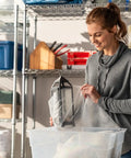 Woman using Pro Grade Small Bubble Cushioning Wrap For Moving And Shipping, 175 Ft Perforated Bubble Roll To Wrap A Decor Item