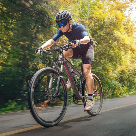 Cyclist riding a road bike equipped with Two Pack 700C Bike Tubes With FV48mm Presta Valve Fits 700x35C to 700x43C Tires