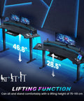 79 Inch Electric Standing Gaming Desk With Drawers And LED Lights Height Adjustable Computer Desk With Power Outlet Keyboard Tray Monitor Stand For Home Office Gaming Setup Wide Black Workstation lit up with blue LED and dual monitors.