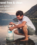 Man using Pocket Sized Portable Travel Wash Bag Featuring Patented Washboard Design Ultra Lightweight Foldable Clothes Cleaner.