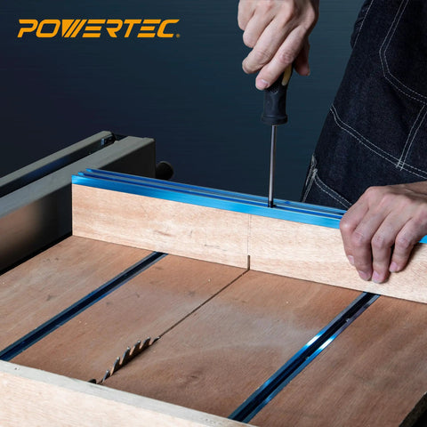 Close-up of hands securing 36 Inch Universal T Track With Double Cut Profile And Pre Drilled Mount Points for use on a table saw.