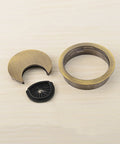 Heavy Duty Zinc Alloy Desk Grommets 3 Pack Totally Fresh Cable Management Cord Hole Covers For Home Office Straight Up Durable Wire Organizers Bronze 2 Inch Desktop Cleanup Kits parts showing bronze finish and black insert.
