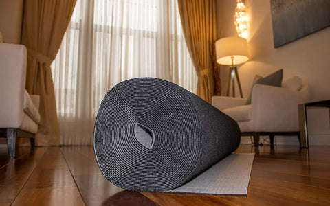 Top Shelf Impact Reducing Sound Blocking Flooring Underlayment For Laminate And Engineered Hardwood, 3.5mm thick rolled black padding.
