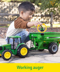 Child playing with One Sixteenth Scale Big Farm 7430 Tractor With Grain Cart Toy Set Featuring Lights And Sounds For Kids