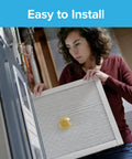 Person installing 16x20x1 Smart Air Filter MPR 2200 MERV 13 Two Pack With Bluetooth Life Tracking For Allergens in furnace