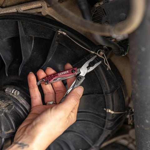 Using 12 In 1 EDC Multitool With Needle Nose Pliers on machinery, highlighting compact, ergonomic design for everyday carry.