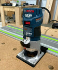 Guide Rail Adapter Compatible With Bosch Colt 1Hp Router For Track Saw Systems, mounted on a workbench for precise cutting.
