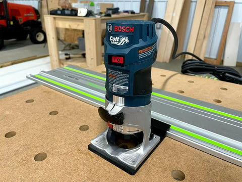 Guide Rail Adapter Compatible With Bosch Colt 1Hp Router For Track Saw Systems, mounted on a workbench for precise cutting.