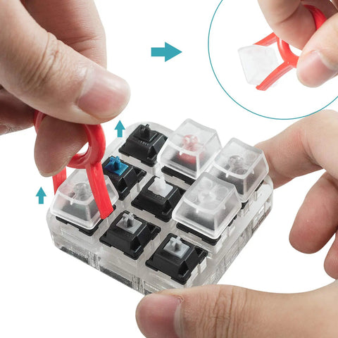 Removing keycaps from Nine Key Cherry MX Switch Tester For Mechanical Keyboards with a clear crystal acrylic base and keycap puller.