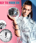 Model holding a 15cm silver ball from 65 Piece Disco Ball Decorations Set With Assorted Size Mirror Ornaments Reflective Hanging Balls.