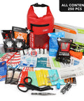 Red roll-top waterproof first aid kit with 250 pieces of medical supplies laid out.