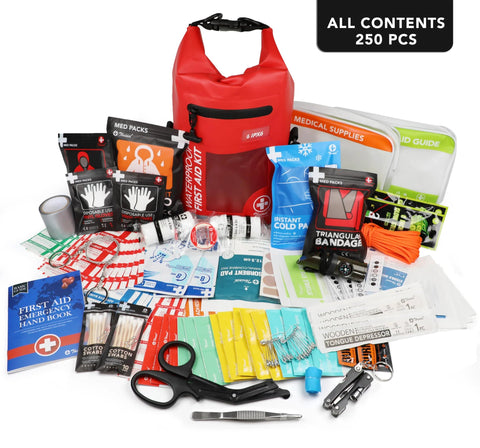 Red roll-top waterproof first aid kit with 250 pieces of medical supplies laid out.