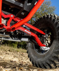 Heavy Duty Arched Boxed Rear Radius Arms For Polaris RZR XP Turbo And XP 4 Turbo 2016 Plus Red, High Clearance For Superior Maneuverability, 4X Stronger Than Stock, Includes Hardware And Instructions, Will Not Fit With Polaris Rear Bumpers. close-up of red rear radius arm on Polaris RZR