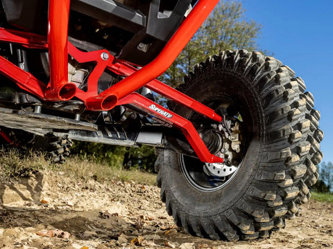 Heavy Duty Arched Boxed Rear Radius Arms For Polaris RZR XP Turbo And XP 4 Turbo 2016 Plus Red, High Clearance For Superior Maneuverability, 4X Stronger Than Stock, Includes Hardware And Instructions, Will Not Fit With Polaris Rear Bumpers. close-up of red rear radius arm on Polaris RZR