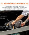 Person loading Heavy Duty Jobsite Duffel Bag For Work Gear With Padded Shoulder Straps 34L into vehicle trunk.