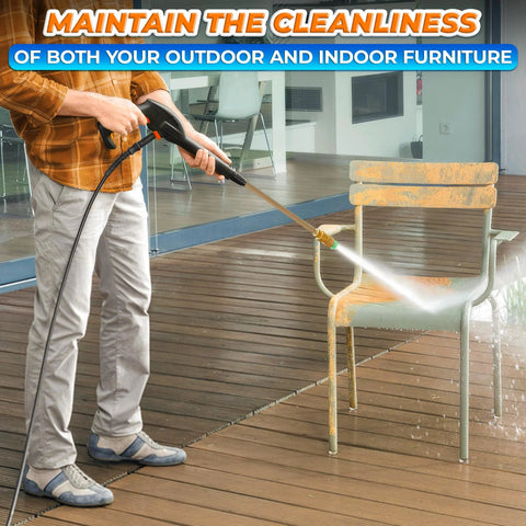 Pressure washer in use cleaning a metal outdoor chair on a wooden deck; spray nozzle visible.