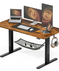 Electric Standing Desk With Easy Height Adjust, Memory Presets And Cable Management, shown with monitors and laptop